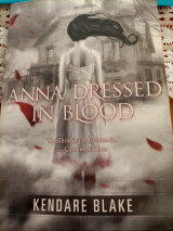Anna dressed in blood