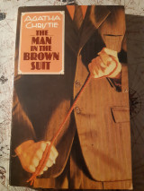 The man in the brown suit